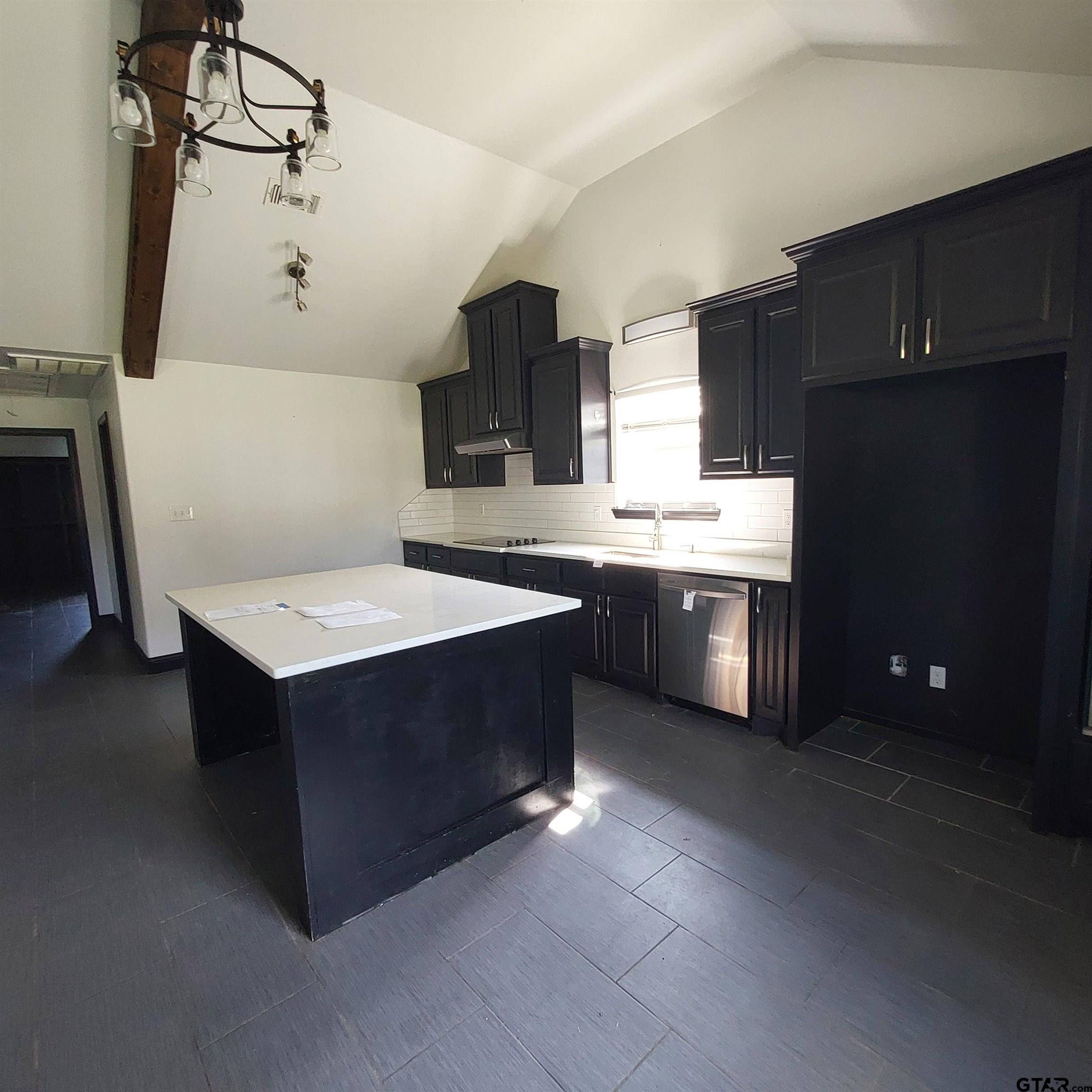 1937 Highway 11 Pittsburg, TX 75686 - Photo 9 of 33 a kitchen with stainless steel appliances a sink stove and cabinets