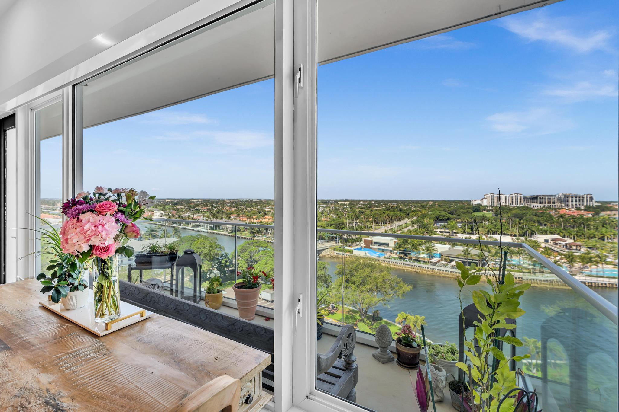 701 East Camino Real, Unit 12G Boca Raton, FL 33432 - Photo 3 of 82 a view of a balcony with chair and a potted plant