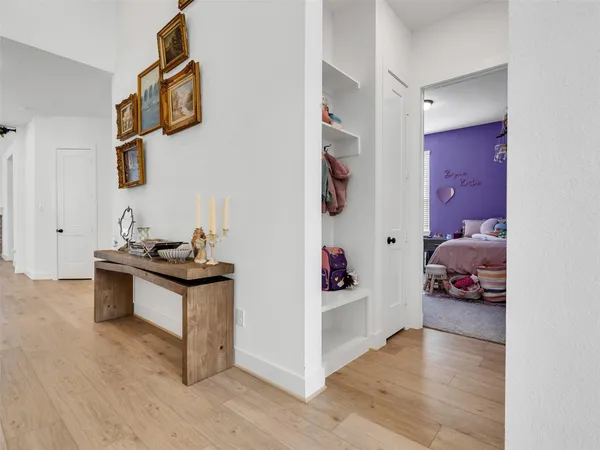 a living room with furniture and a mirror
