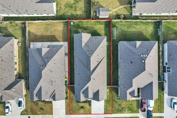 an aerial view of a house with a garden