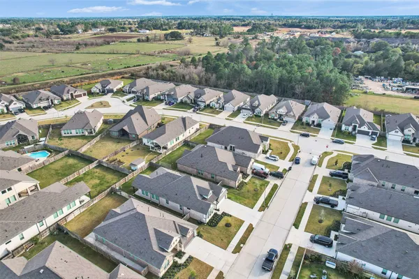 an aerial view of a house with a lake view