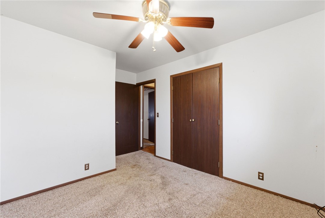6711 Hamilton-Middletown Road Franklin, OH 45005 - Photo 24 of 49 This cozy bedroom offers a comfortable retreat with soft carpeting and functional closets.
