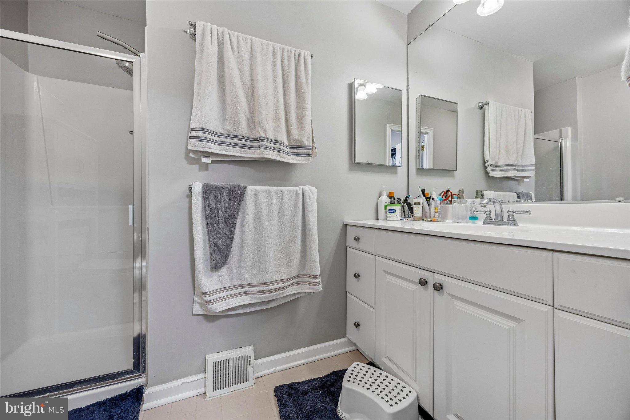 24 Independence Place Newtown, PA 18940 - Photo 12 of 15 a bathroom with a sink a vanity and a mirror