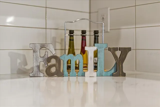 a kitchen with a table and chairs in it
