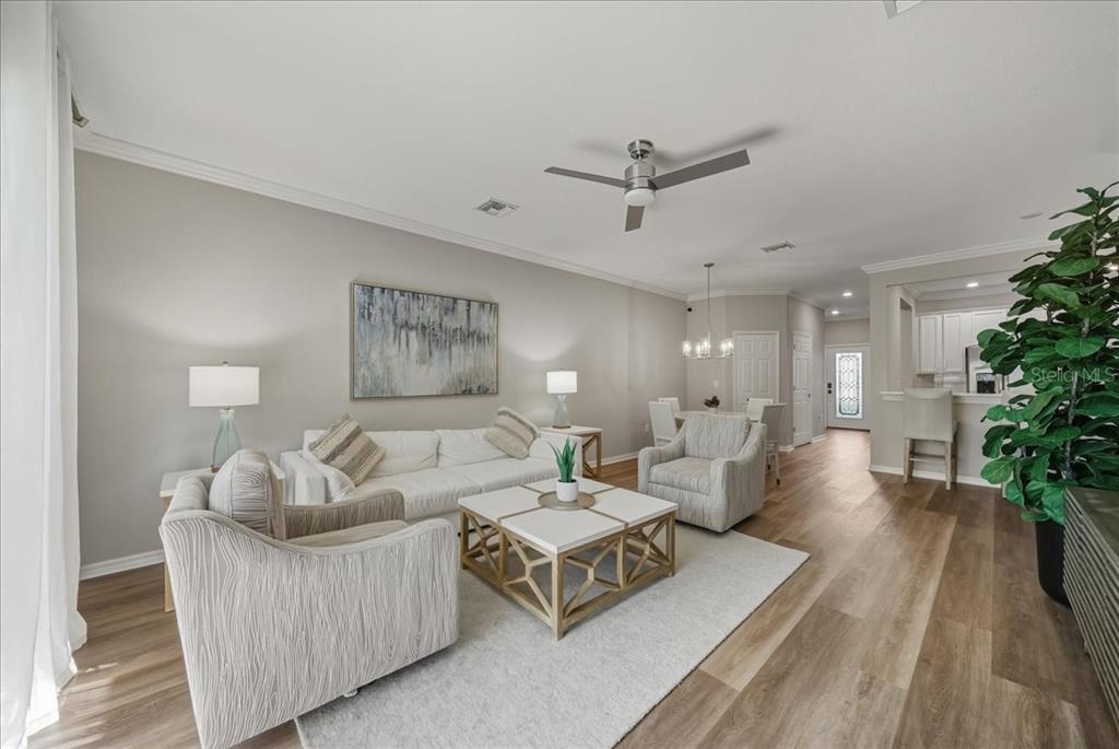 7224 Ketch Place Bradenton, FL 34212 - Photo 17 of 70 a living room with furniture and a potted plant