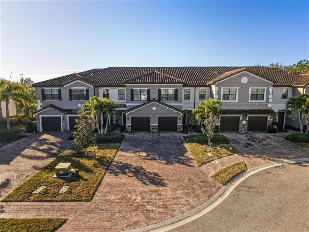 7224 Ketch Place Bradenton, FL 34212 - Photo 2 of 70 a front view of a house with a yard