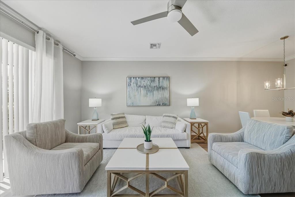 7224 Ketch Place Bradenton, FL 34212 - Photo 21 of 70 a living room with furniture and a large window