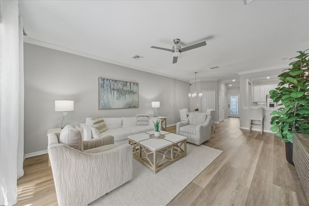 7224 Ketch Place Bradenton, FL 34212 - Photo 22 of 70 a living room with furniture and a potted plant