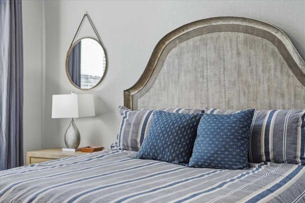 7224 Ketch Place Bradenton, FL 34212 - Photo 28 of 70 a bedroom with a bed and a mirror