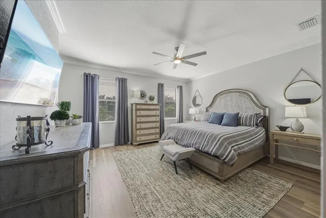a bedroom with a bed and a book shelf