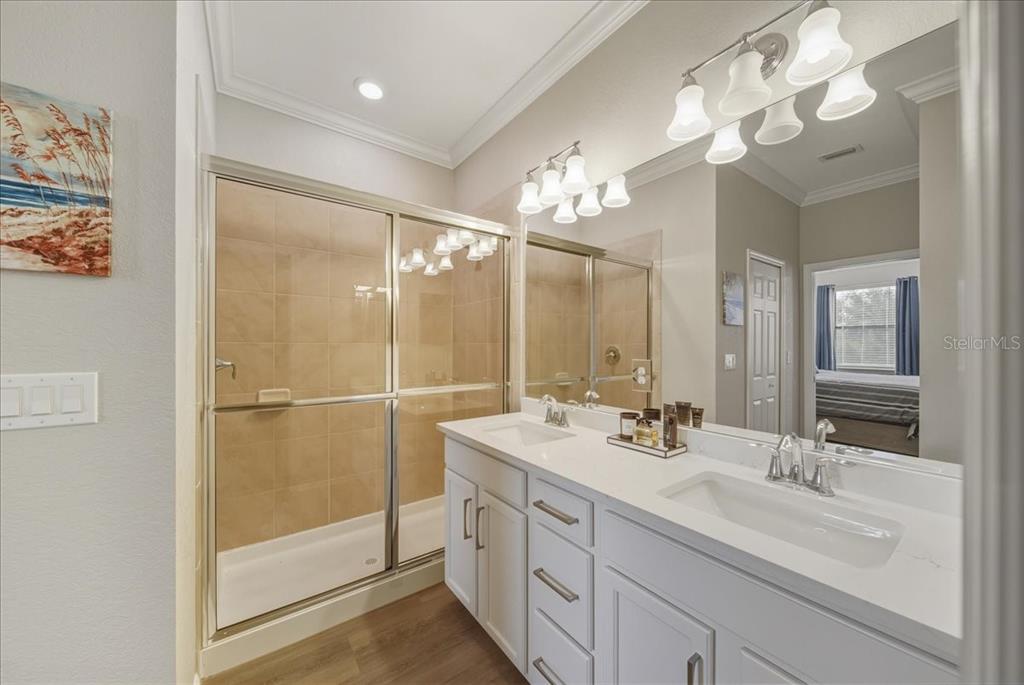 7224 Ketch Place Bradenton, FL 34212 - Photo 36 of 70 a bathroom with a double vanity sink mirror and shower