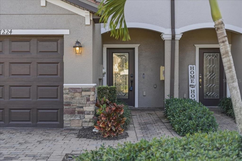 7224 Ketch Place Bradenton, FL 34212 - Photo 4 of 70 a front view of a house with a yard