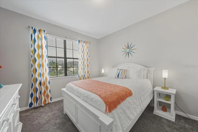 a view of a water fountain and trees in the background
