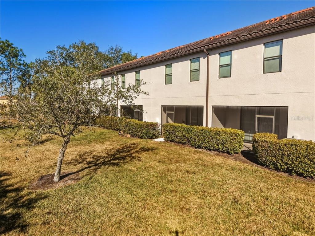 7224 Ketch Place Bradenton, FL 34212 - Photo 54 of 70 a front view of a house with a yard