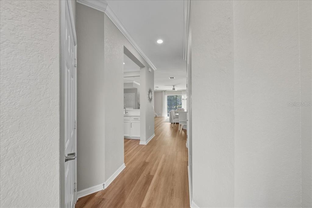 7224 Ketch Place Bradenton, FL 34212 - Photo 6 of 70 a view of a hallway with wooden floor