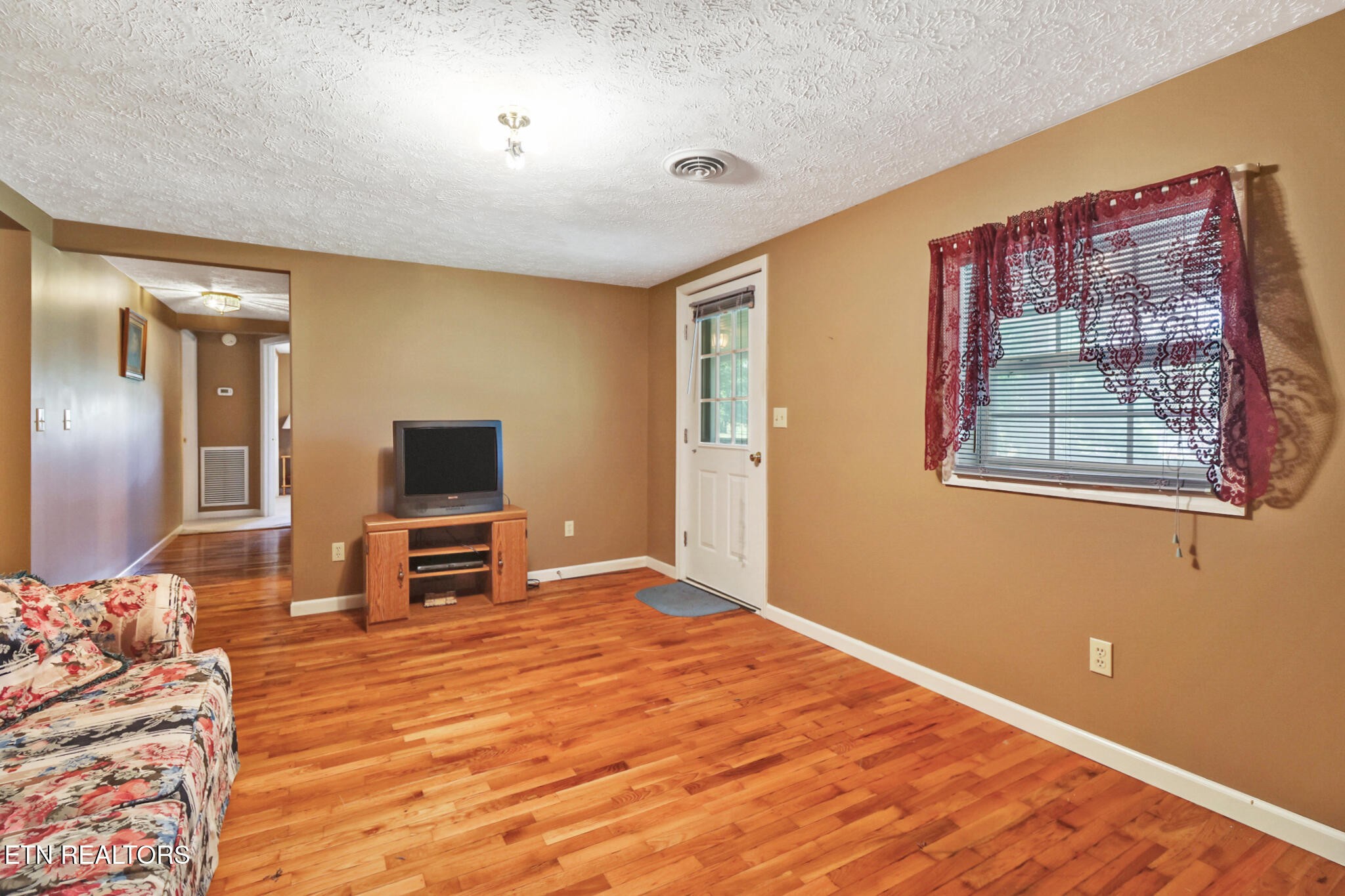 1729 Roslin Road Jamestown, TN 38556 - Photo 11 of 49 a bedroom with a bed and a flat screen tv