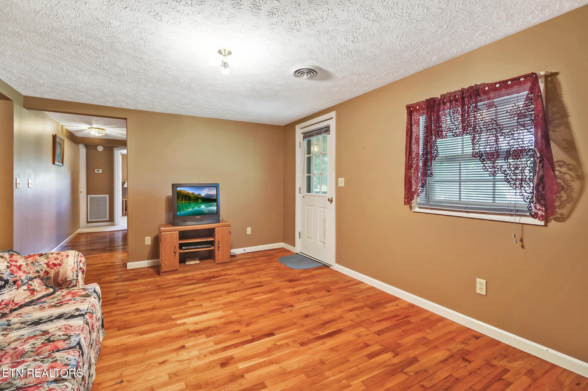 1729 Roslin Road Jamestown, TN 38556 - Photo 12 of 49 a view of a livingroom with wooden floor and furniture