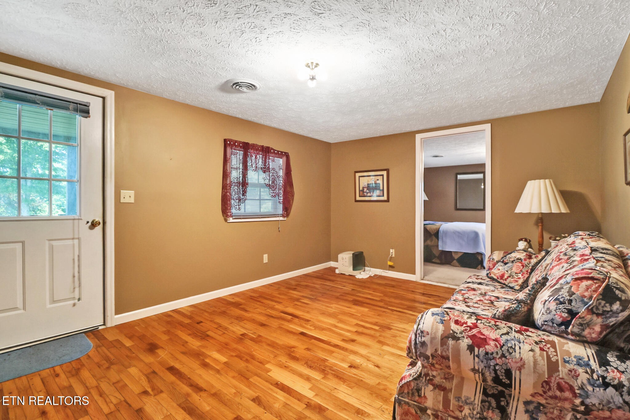 1729 Roslin Road Jamestown, TN 38556 - Photo 15 of 49 a bedroom with a large bed and a window