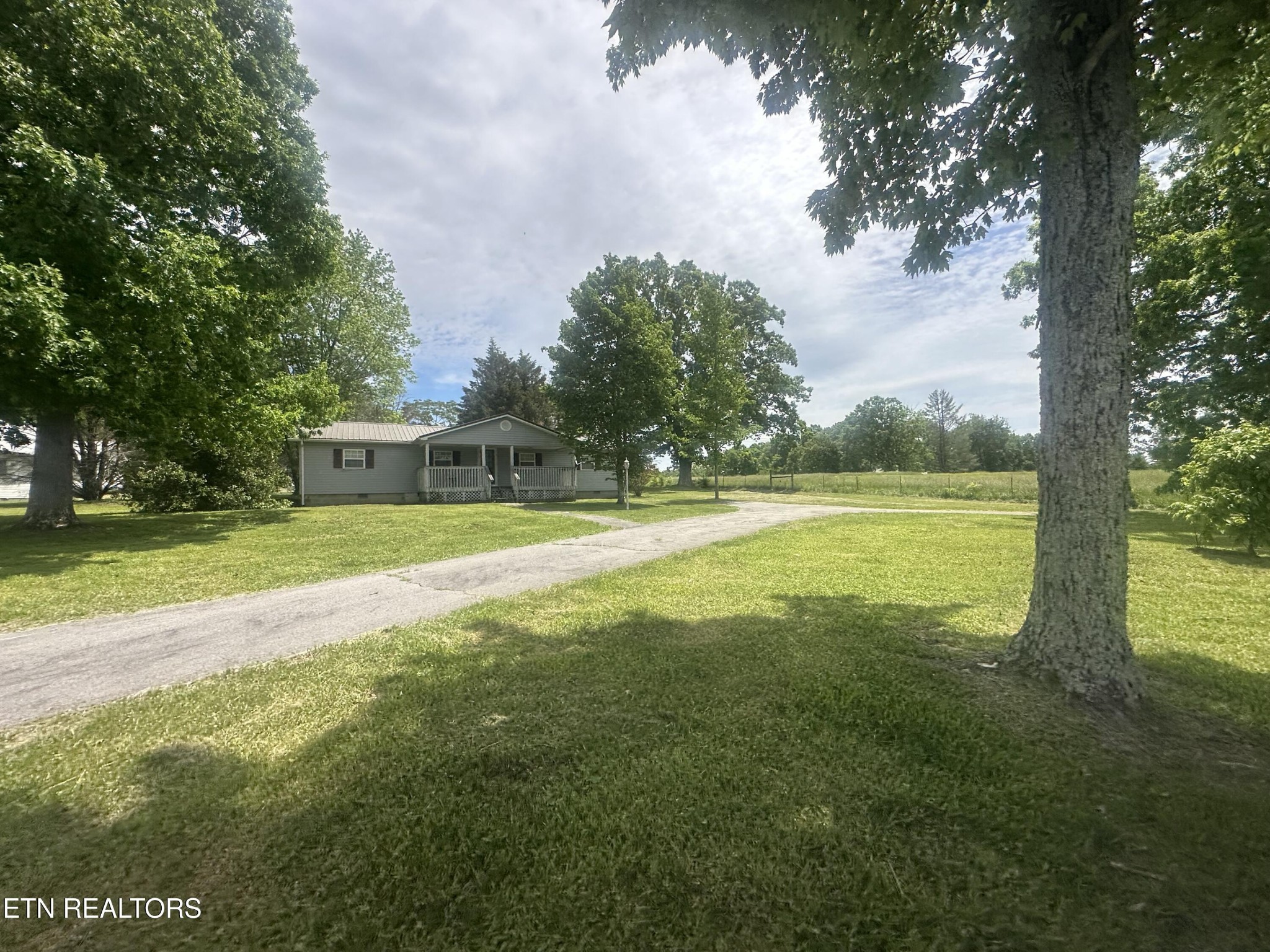 1729 Roslin Road Jamestown, TN 38556 - Photo 3 of 49 a view of a house with a big yard