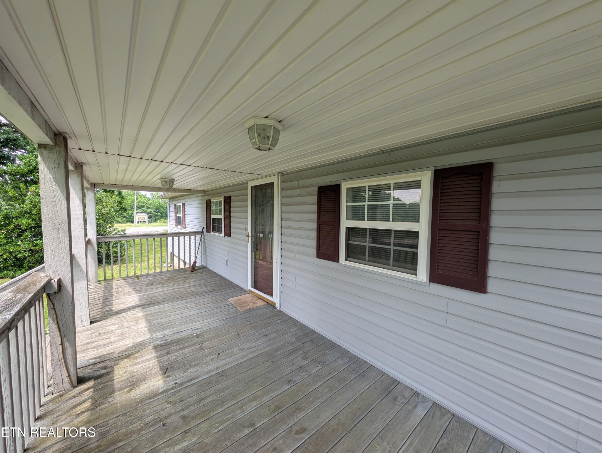 1729 Roslin Road Jamestown, TN 38556 - Photo 44 of 49 a view of an empty room with wooden floor and a window