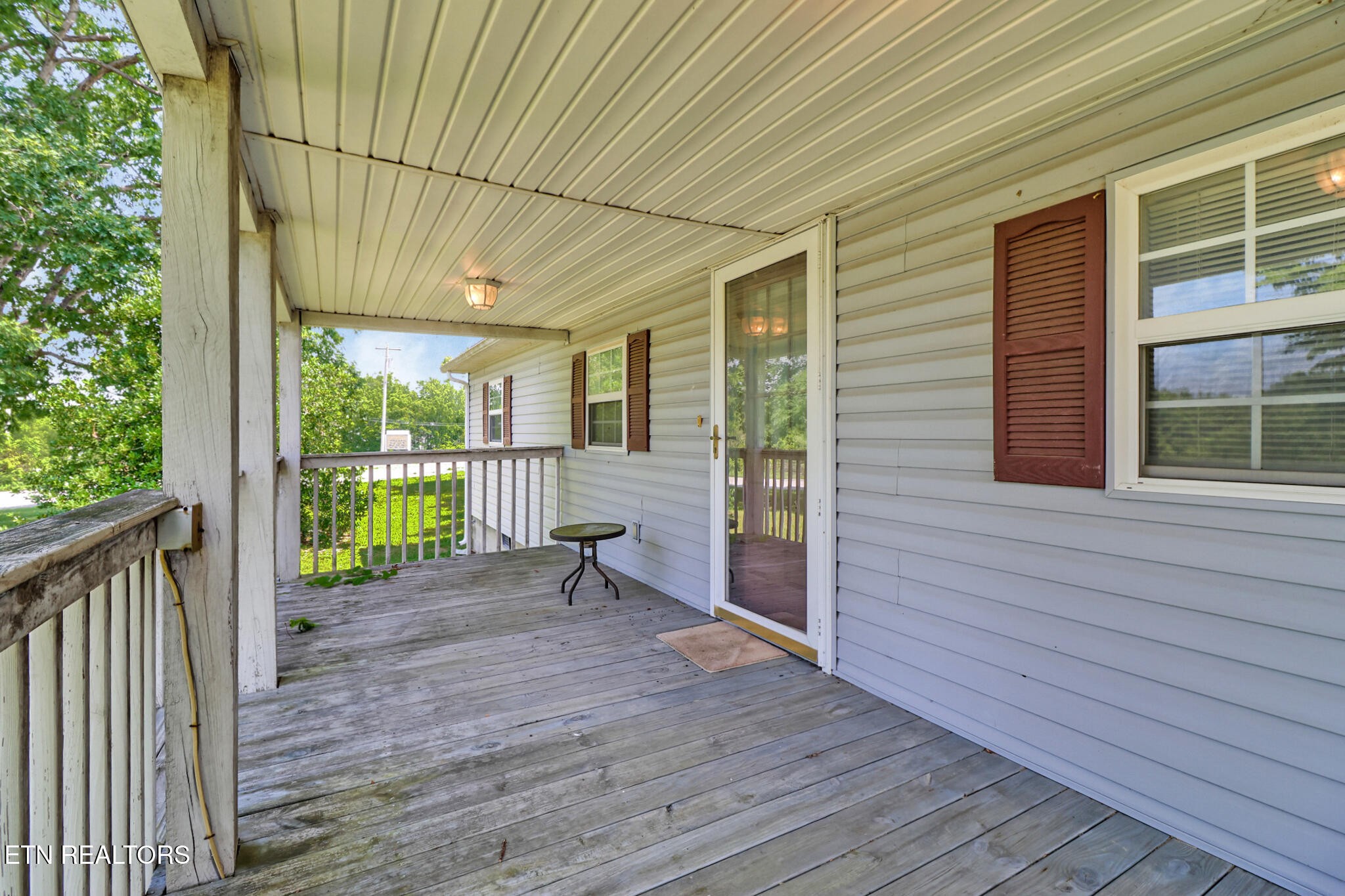 1729 Roslin Road Jamestown, TN 38556 - Photo 8 of 49 a view of a porch with wooden floor and fence