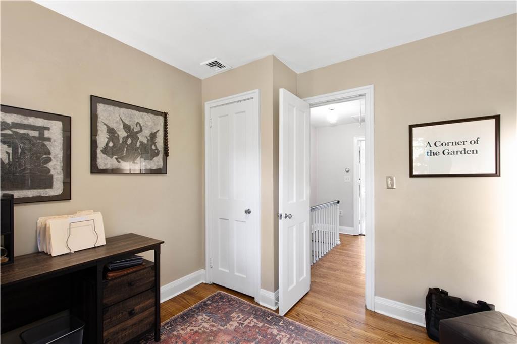 454 Sulgrave Road Pittsburgh, PA 15211 - Photo 19 of 50 a view of a hallway with paintings on the wall