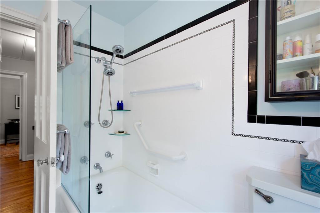 454 Sulgrave Road Pittsburgh, PA 15211 - Photo 25 of 50 a bathroom with a shower and a sink