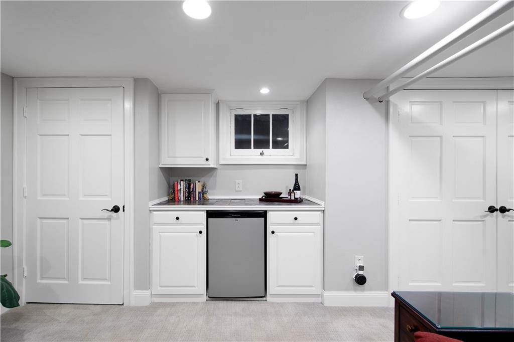 454 Sulgrave Road Pittsburgh, PA 15211 - Photo 28 of 50 a kitchen with cabinets and wooden floor
