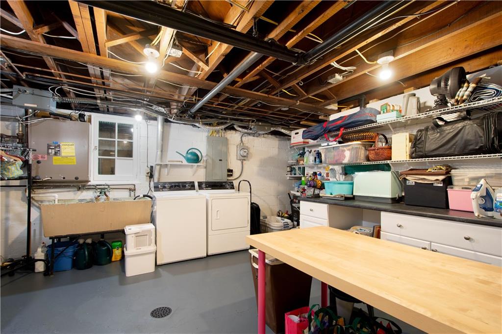 454 Sulgrave Road Pittsburgh, PA 15211 - Photo 31 of 50 a utility room with cabinets dryer and washer