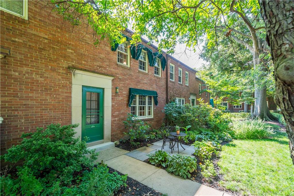 454 Sulgrave Road Pittsburgh, PA 15211 - Photo 4 of 50 a front view of a house with plants and garden