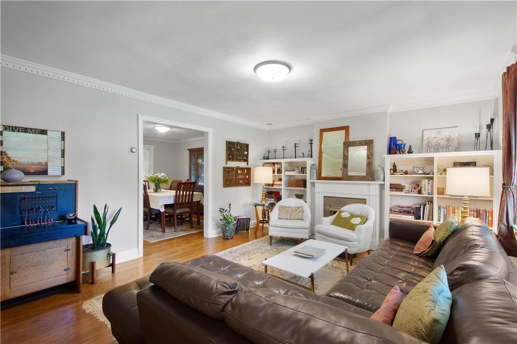 454 Sulgrave Road Pittsburgh, PA 15211 - Photo 7 of 50 a living room with furniture and a wooden floor