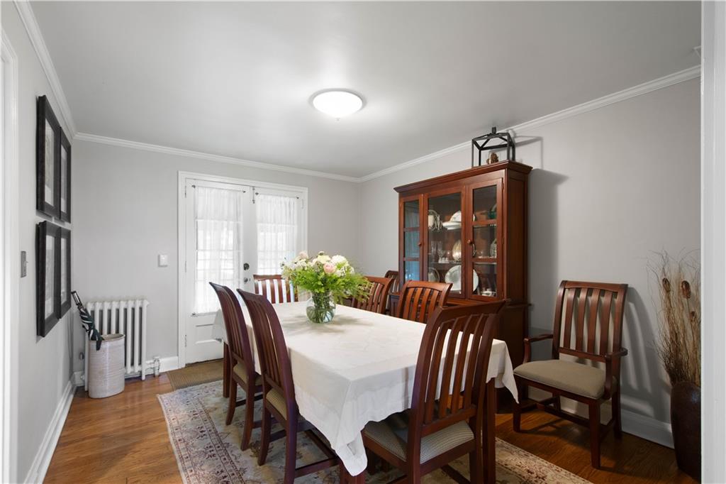454 Sulgrave Road Pittsburgh, PA 15211 - Photo 10 of 50 a view of a dining room with furniture window and wooden floor