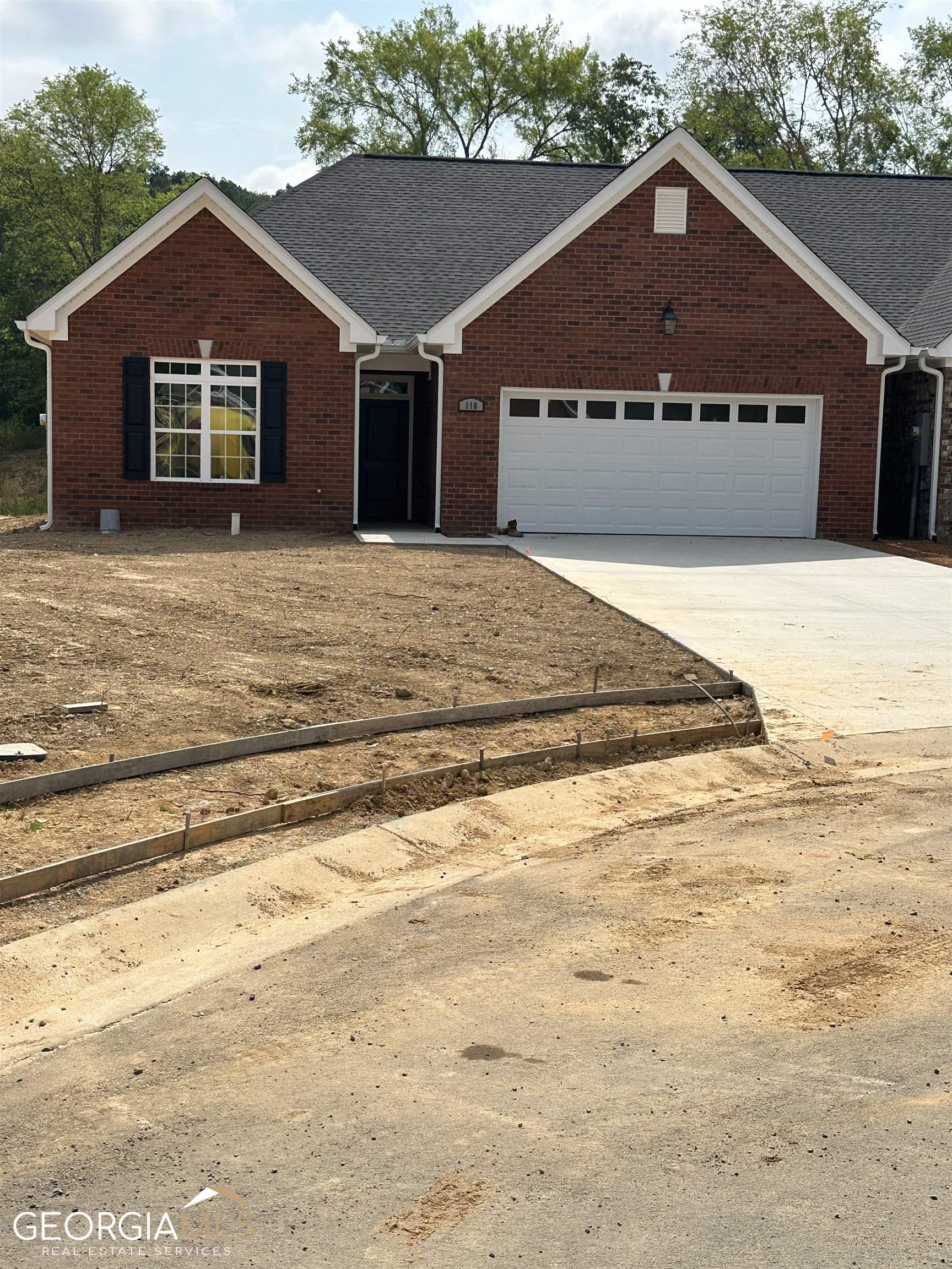116 Southwest Freedoms Way Calhoun, GA 30701 - Photo 1 of 1 a front view of a house with a yard