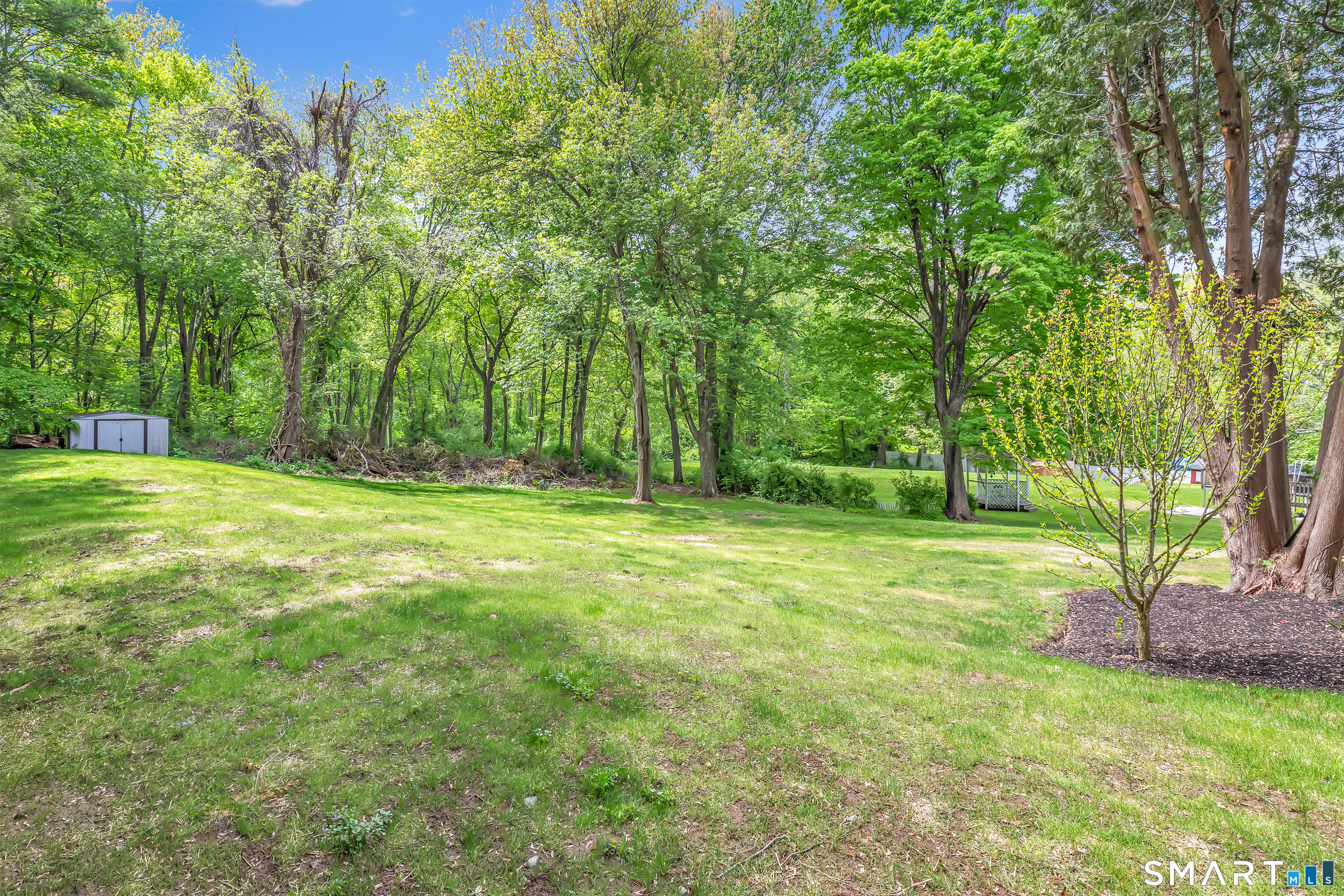 7 Longview Road Newtown, CT 06482 - Photo 35 of 40 a backyard of a house with lots of green space
