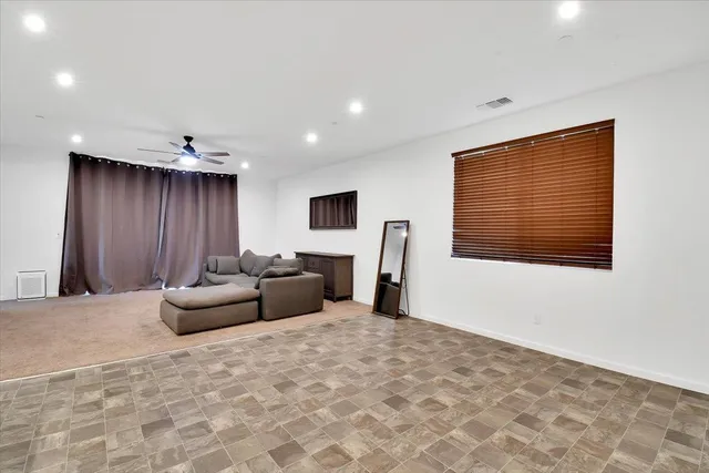 a kitchen with kitchen island a sink stainless steel appliances and cabinets