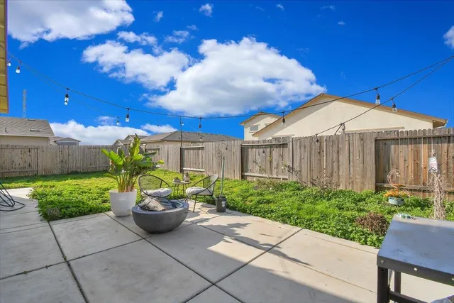 a house view with a backyard space