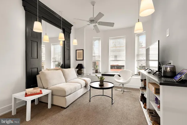 a living room with furniture and a large window