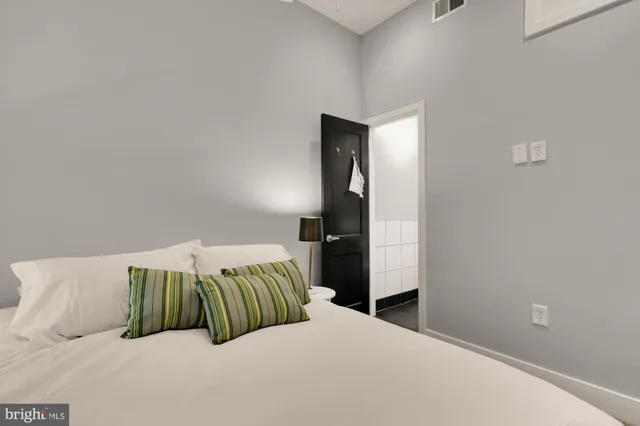 a bedroom with a bed and closet