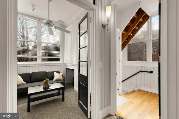 a bedroom with furniture and a window