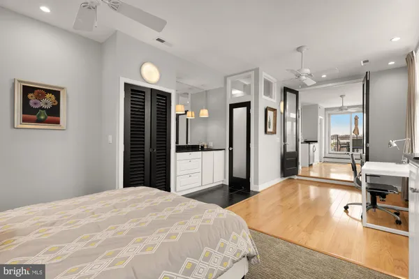 a bedroom with a bed and a view of bathroom