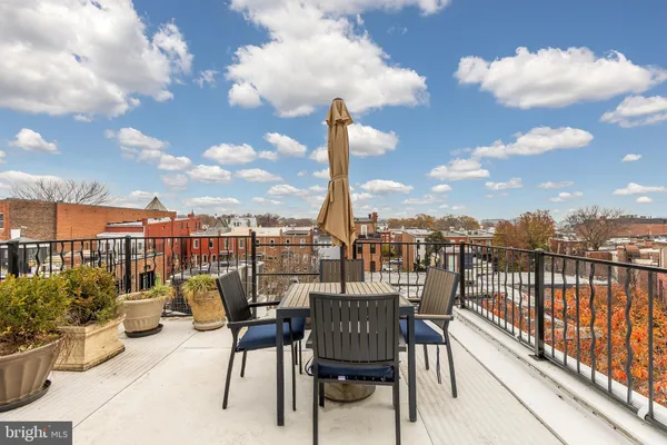 a view of a balcony with sitting space