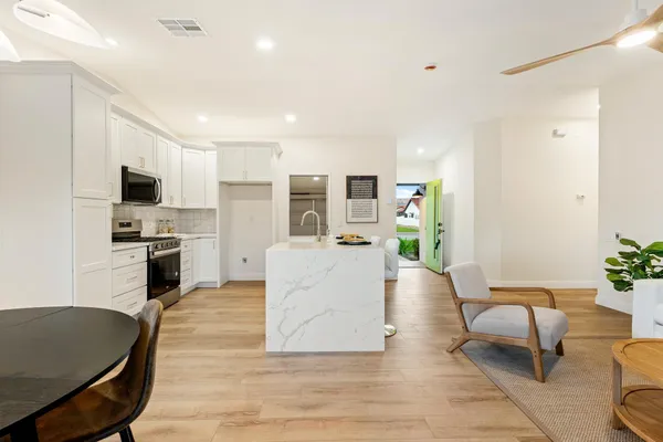 a living room with furniture and a fireplace