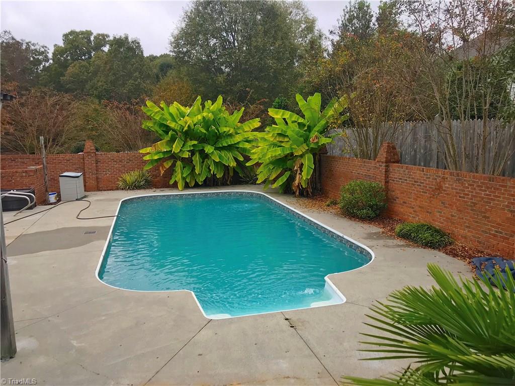 135 Old March Road Advance, NC 27006 - Photo 23 of 26 Inground Pool Surrounded by Beautiful Brick Wall