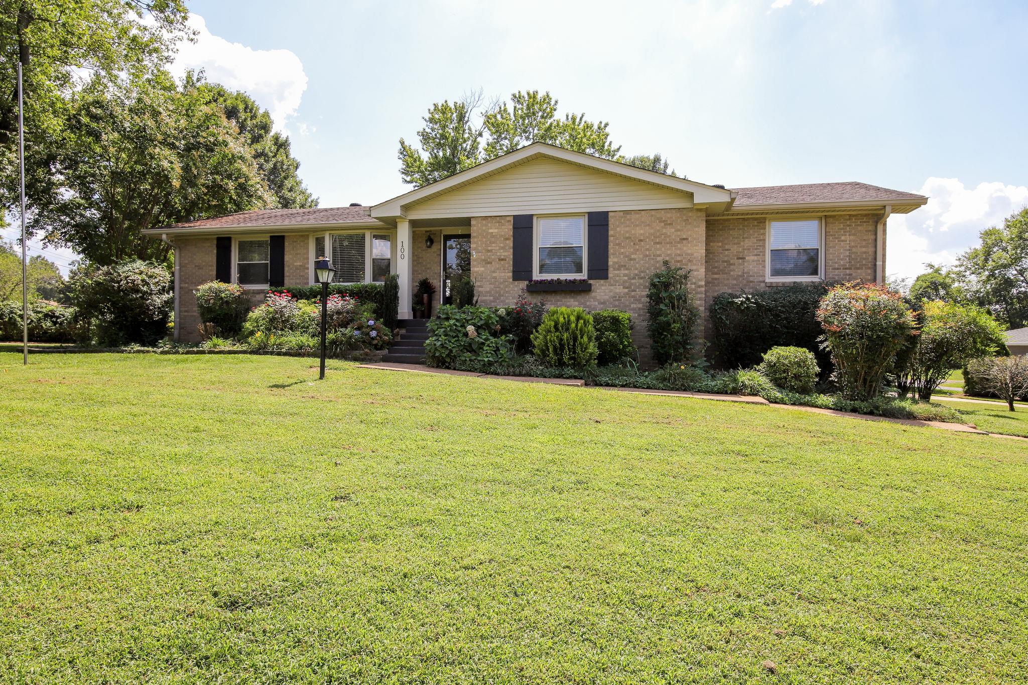 100 Chiroc Road Hendersonville, TN 37075 - Photo 1 of 28 Beautiful rancher with full basement sitting on half acre corner lot with cirucular drive at rear and HUGE deck!