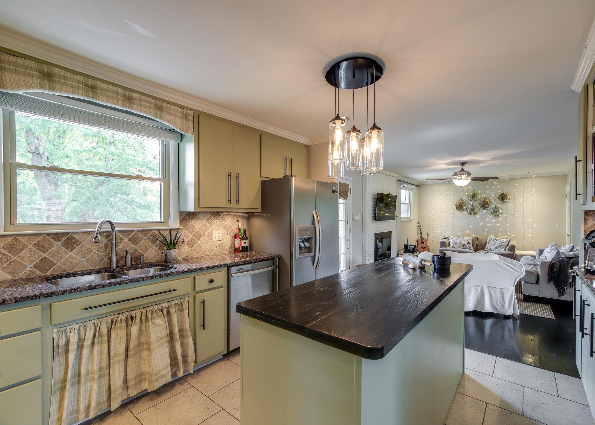 100 Chiroc Road Hendersonville, TN 37075 - Photo 11 of 28 From far end of kitchen. Granite. Tile. Backsplash. So comfortable and great work space.