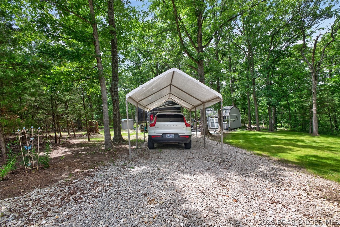 25145 State Route West Barnett, MO 65011 - Photo 44 of 58 Carport by large RV parking pad.