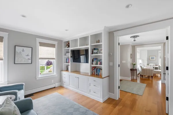 a living room with furniture and a book shelf