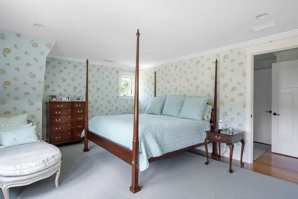 a bedroom with a bed and a table