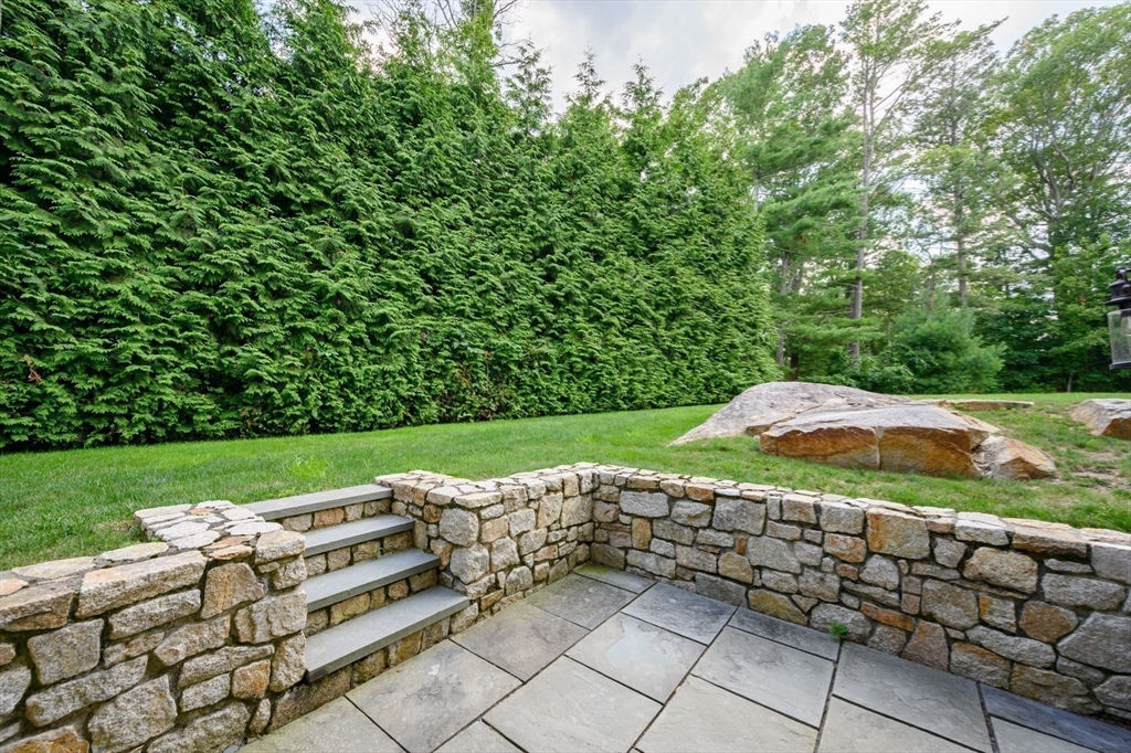25 Mohawk Way Cohasset, MA 02025 - Photo 30 of 34 a view of a garden with an outdoor seating