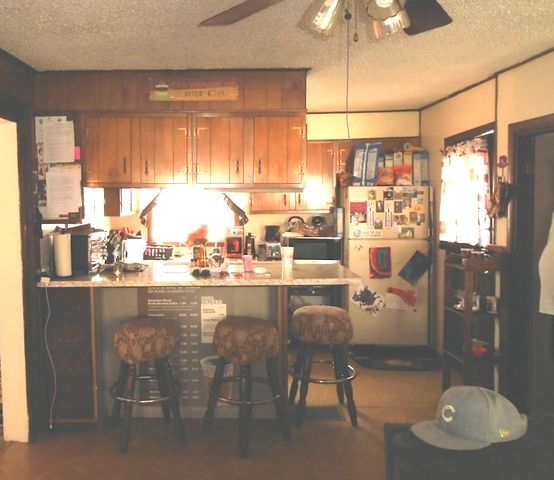 609 North 3rd Street Rochelle, IL 61068 - Photo 2 of 15 a kitchen with stainless steel appliances granite countertop a sink and a table